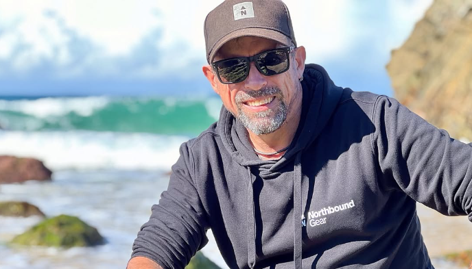 A Man wearing Northbound Gear cap and hoodie